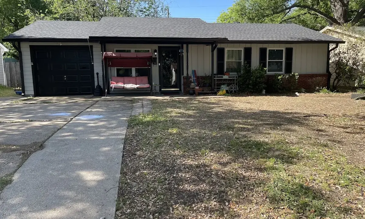Asphalt Shingle Roof Repair crew at work on a residential roof in Montgomery
